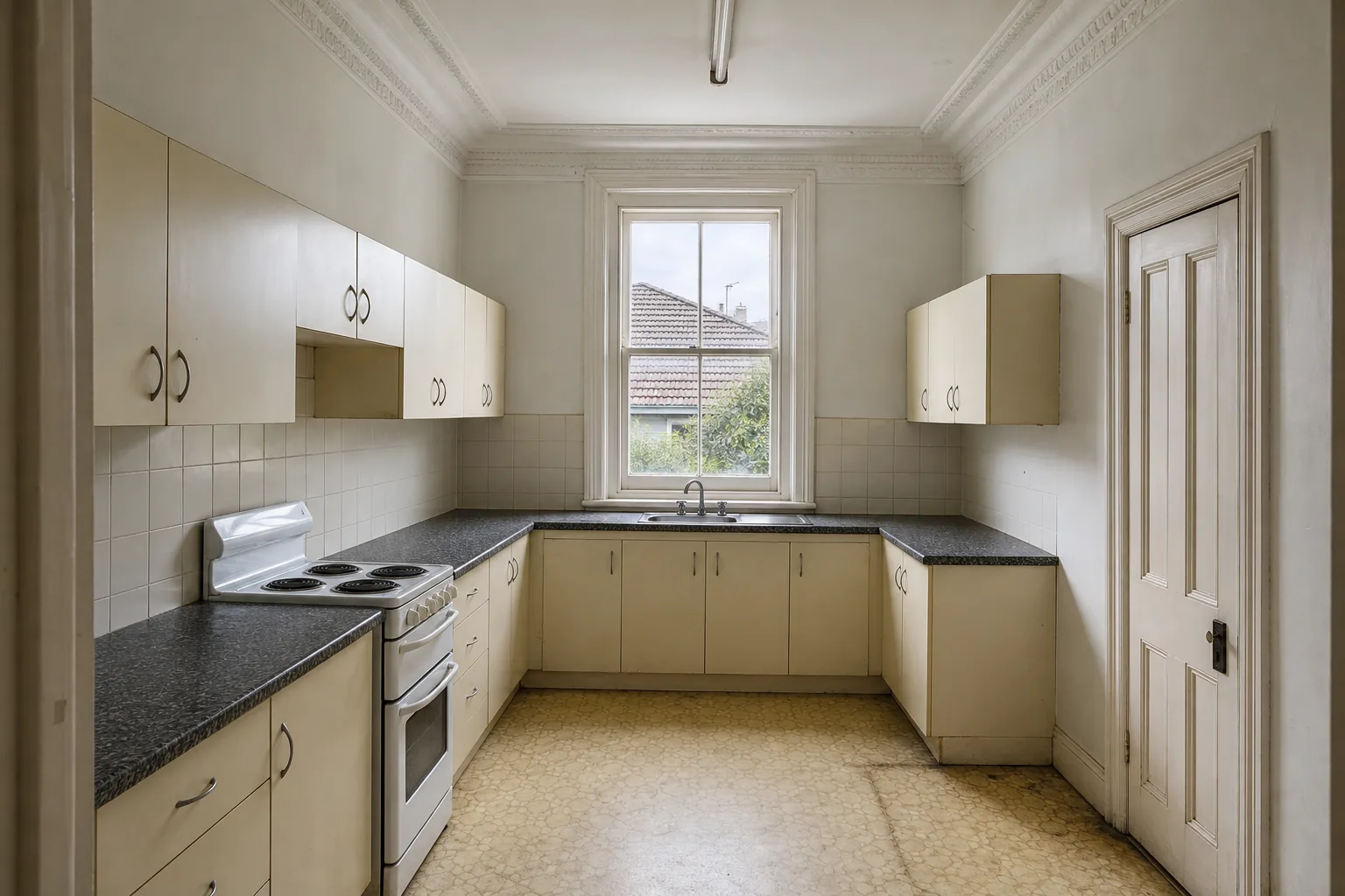 Representative Federation kitchen concept before renovation with dated cream cabinetry