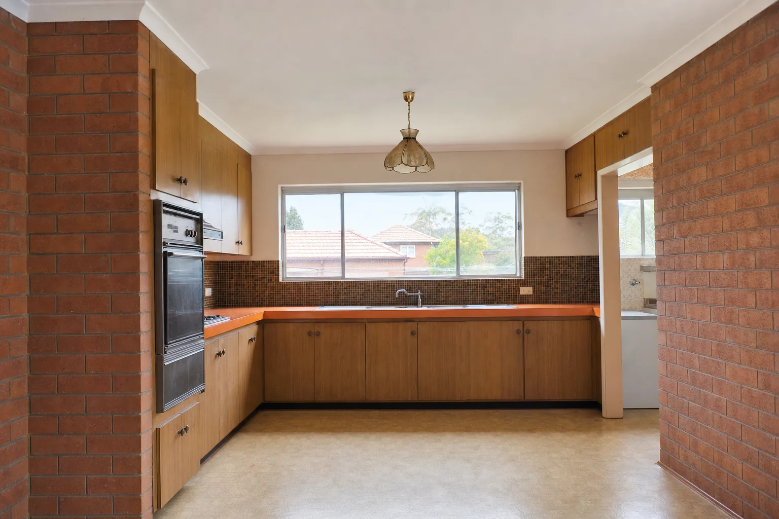 Representative 1960s brick home kitchen concept before renovation